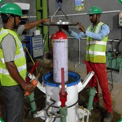 Technicians running a hydrostatic test on a CNG cylinder